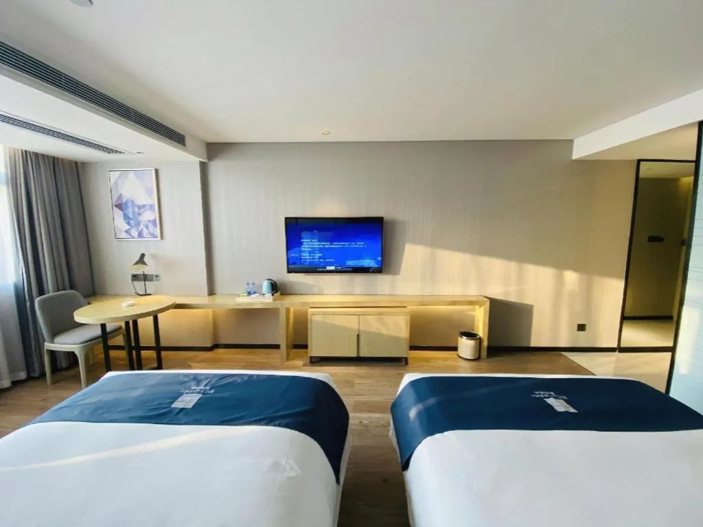 Bed in Echarm Hotel Nanning Qingxiu Mountain