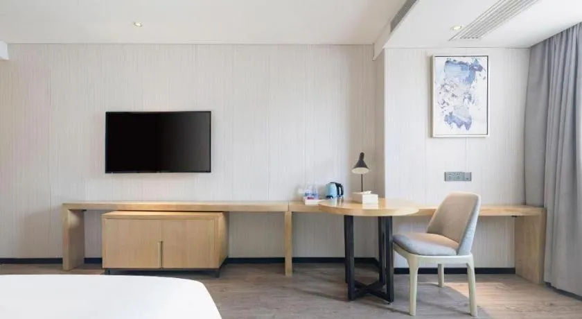 Bed in Echarm Hotel Nanning Qingxiu Mountain