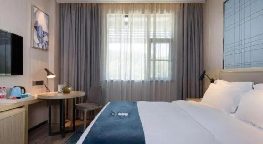 Bed in Echarm Hotel Nanning Qingxiu Mountain