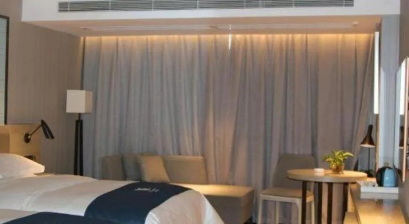 Bed in Echarm Hotel Nanning Qingxiu Mountain