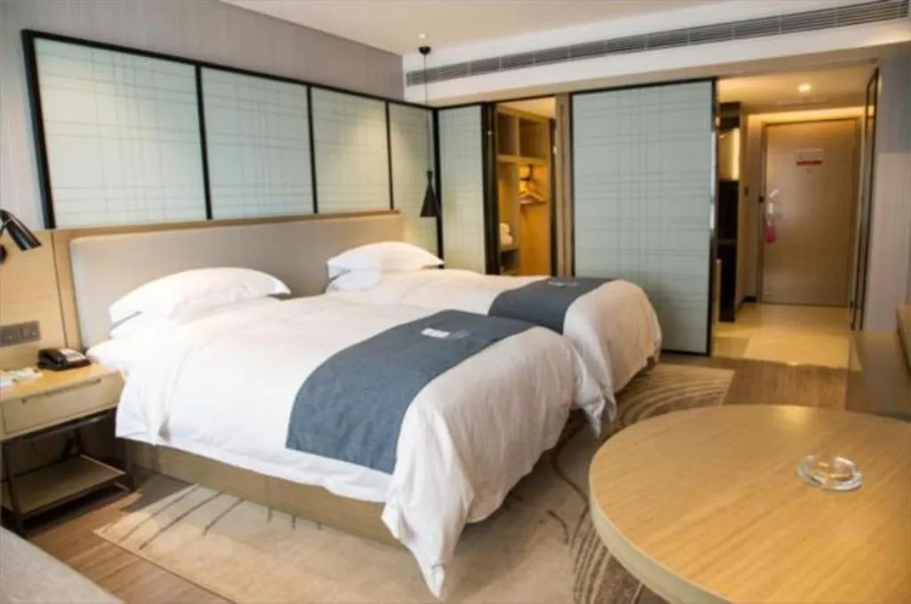 Bed in Echarm Hotel Nanning Qingxiu Mountain