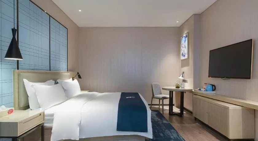 Bed in Echarm Hotel Nanning Qingxiu Mountain