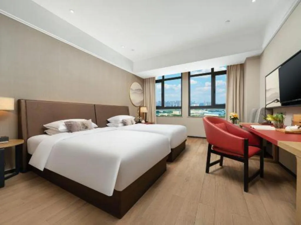 Bed in Echeng Hotel Nanning Jiangnan Wanda Baisha Avenue