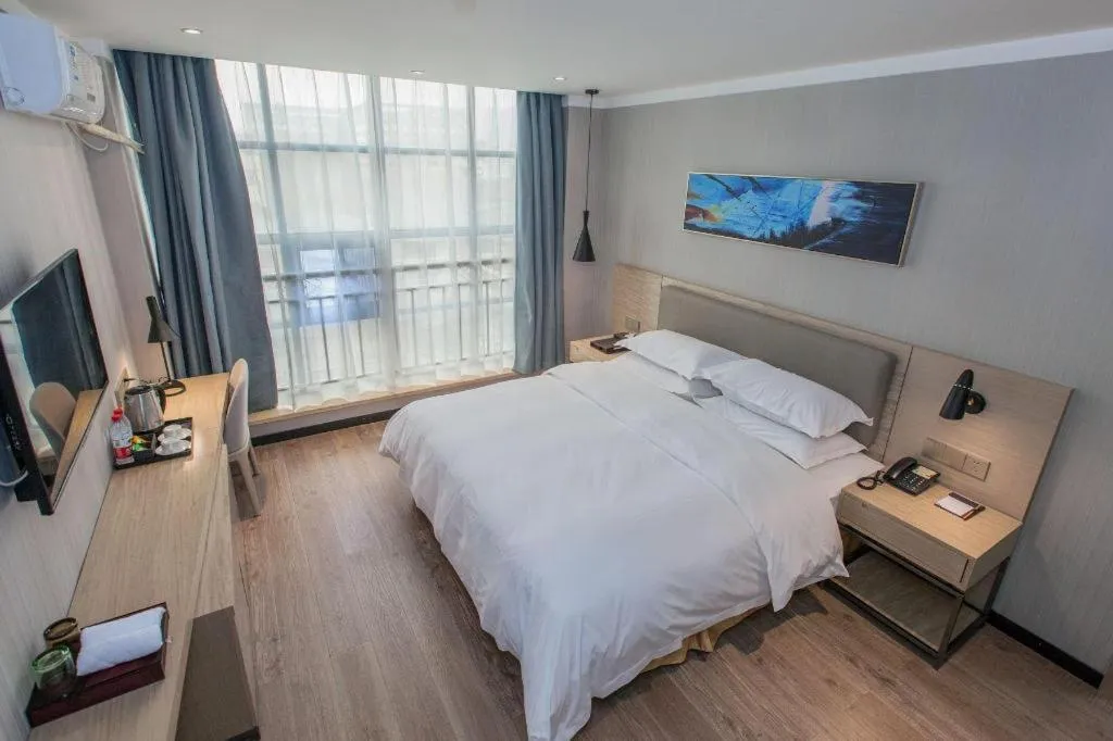 Bed in Borrman Hotel Wuhan Yangluo Metro Station Shenshuigang