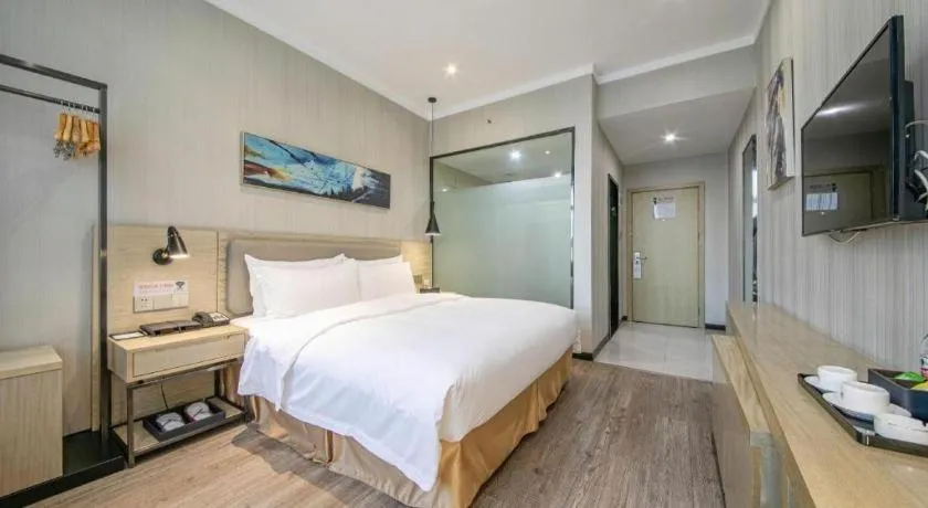 Bed in Borrman Hotel Wuhan Yangluo Metro Station Shenshuigang