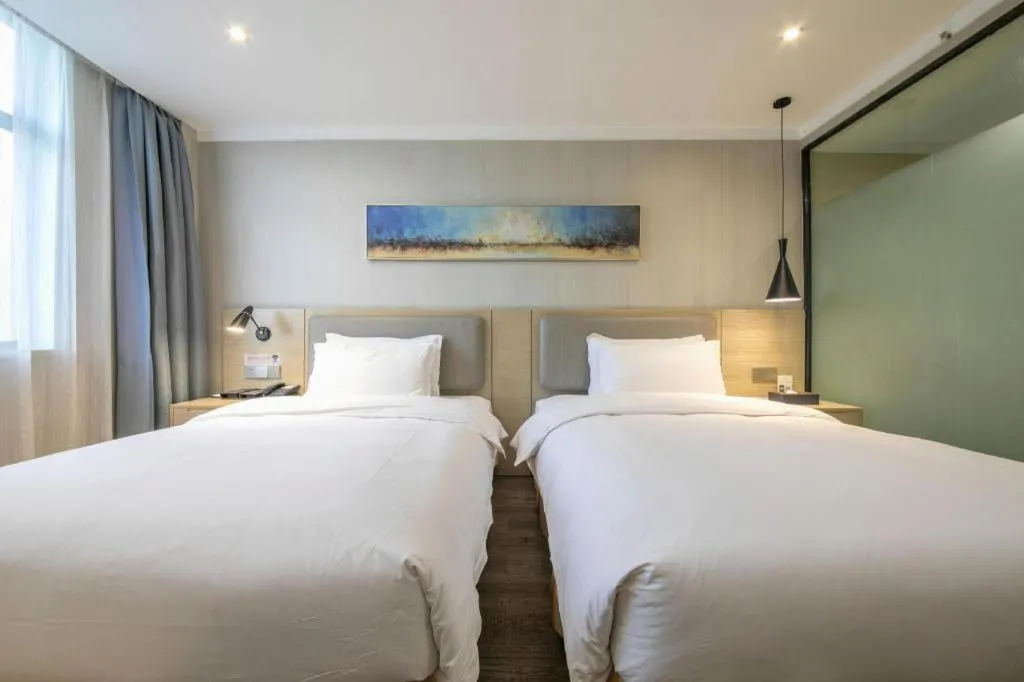 Bed in Borrman Hotel Wuhan Yangluo Metro Station Shenshuigang