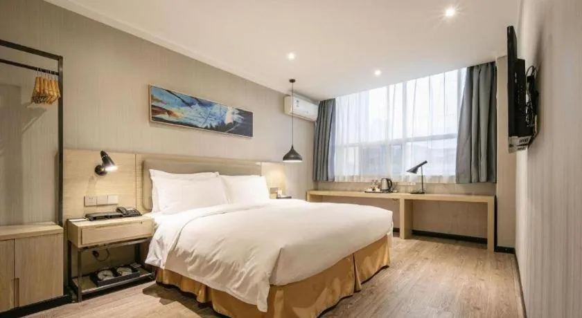 Bed in Borrman Hotel Wuhan Yangluo Metro Station Shenshuigang