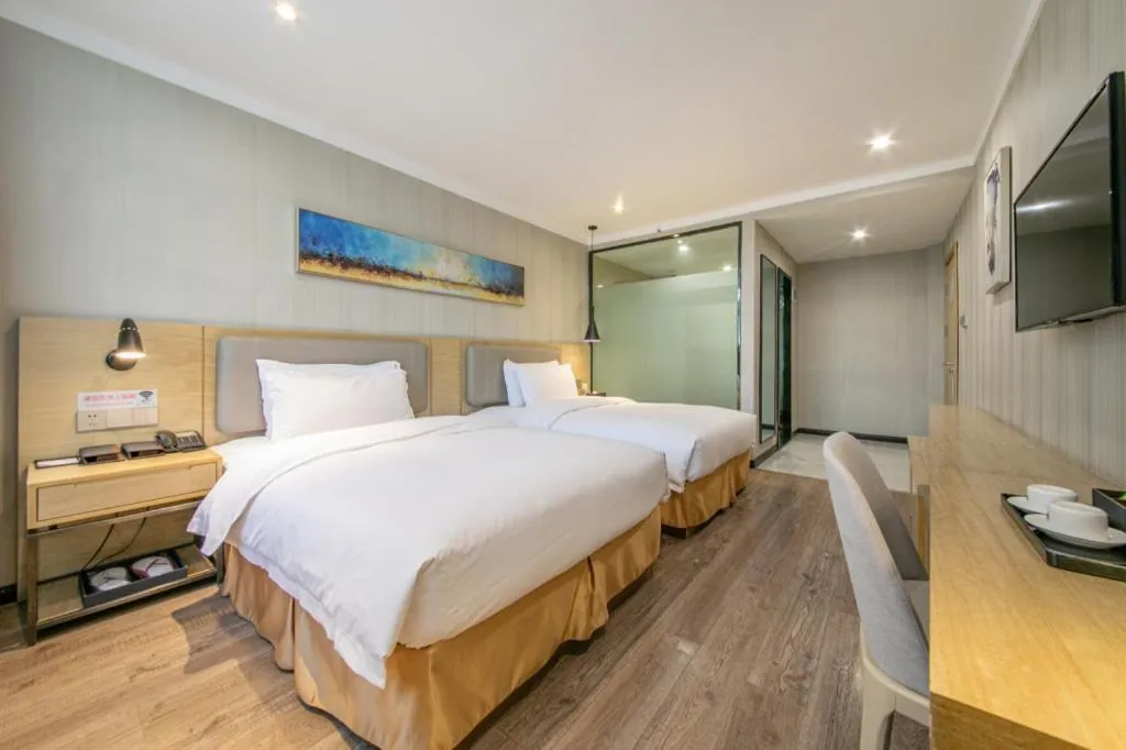 Bed in Borrman Hotel Wuhan Yangluo Metro Station Shenshuigang