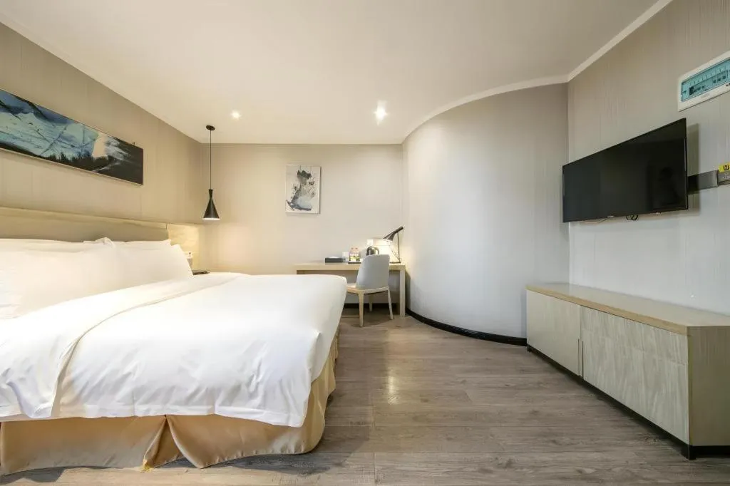 Bed in Borrman Hotel Wuhan Yangluo Metro Station Shenshuigang