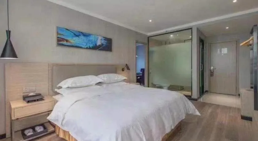 Bed in Borrman Hotel Wuhan Yangluo Metro Station Shenshuigang