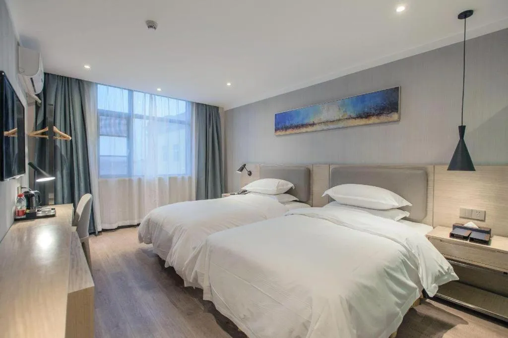 Bed in Borrman Hotel Wuhan Yangluo Metro Station Shenshuigang