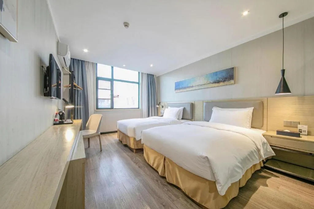 Bed in Borrman Hotel Wuhan Yangluo Metro Station Shenshuigang