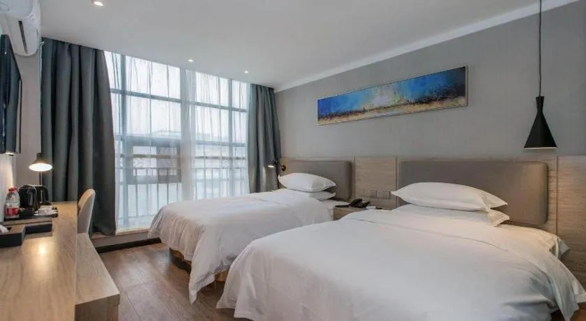 Bed in Borrman Hotel Wuhan Yangluo Metro Station Shenshuigang