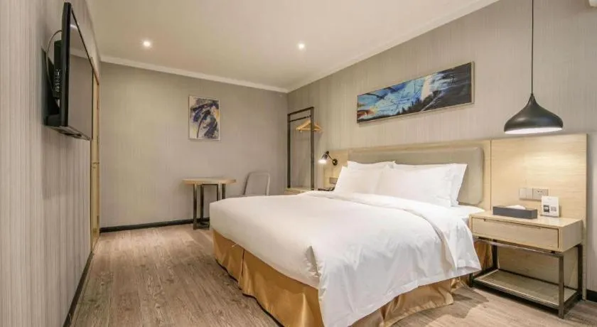 Bed in Borrman Hotel Wuhan Yangluo Metro Station Shenshuigang