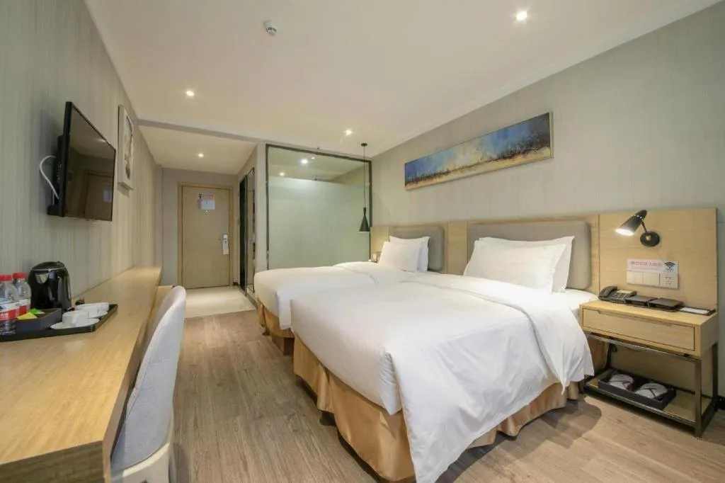 Bed in Borrman Hotel Wuhan Yangluo Metro Station Shenshuigang