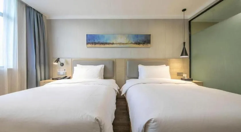 Bed in Borrman Hotel Wuhan Yangluo Metro Station Shenshuigang