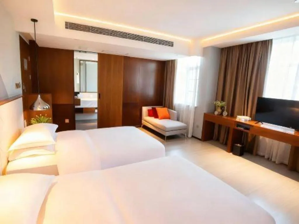 Bed in Borrman Hotel Zhongxiang Railway Station Mochou Village