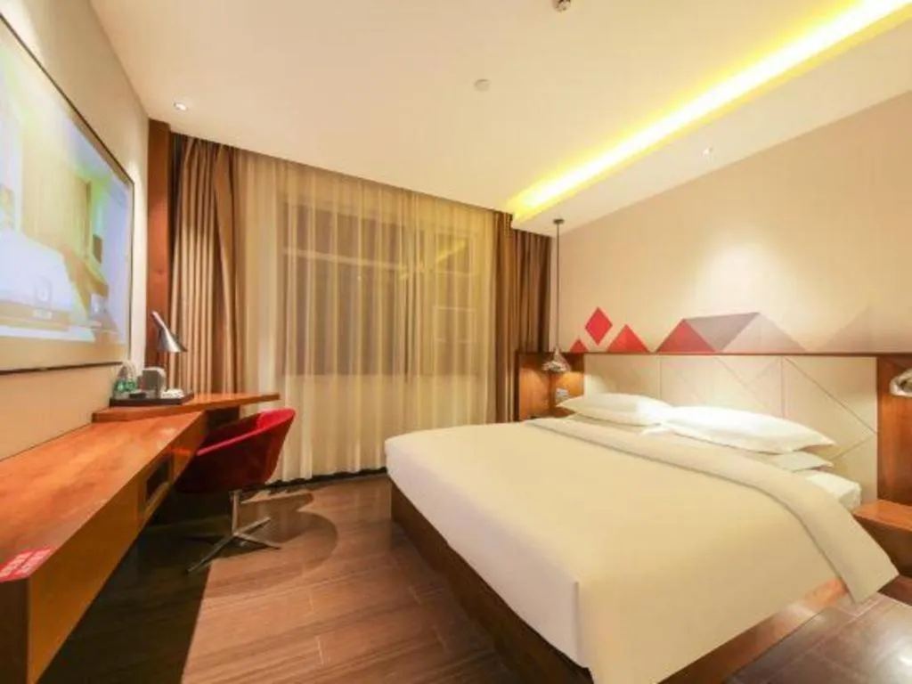 Bed in Borrman Hotel Zhongxiang Railway Station Mochou Village