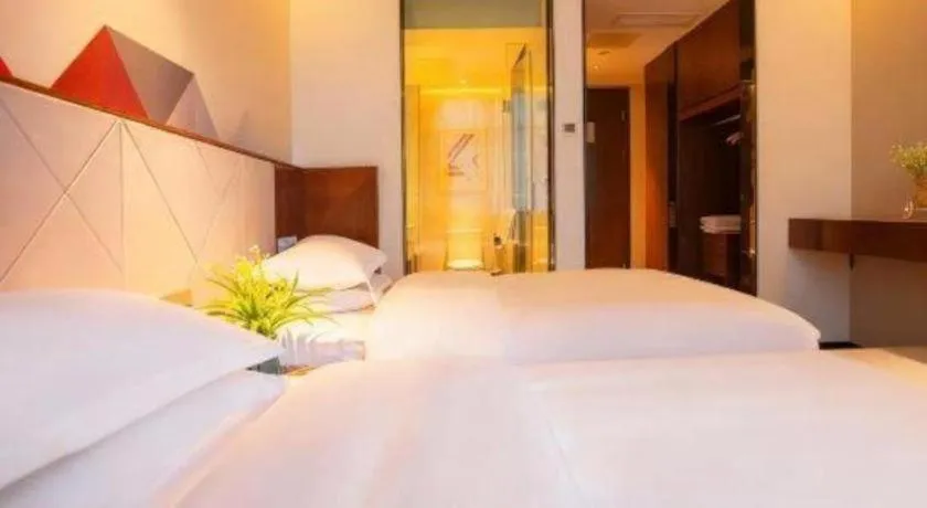 Bed in Borrman Hotel Zhongxiang Railway Station Mochou Village