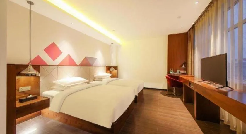 Bed in Borrman Hotel Zhongxiang Railway Station Mochou Village