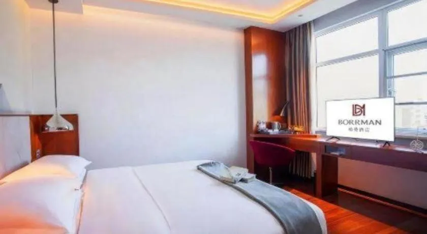 Bed in Borrman Hotel Zhongxiang Railway Station Mochou Village