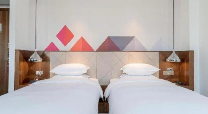Bed in Borrman Hotel Zhongxiang Railway Station Mochou Village