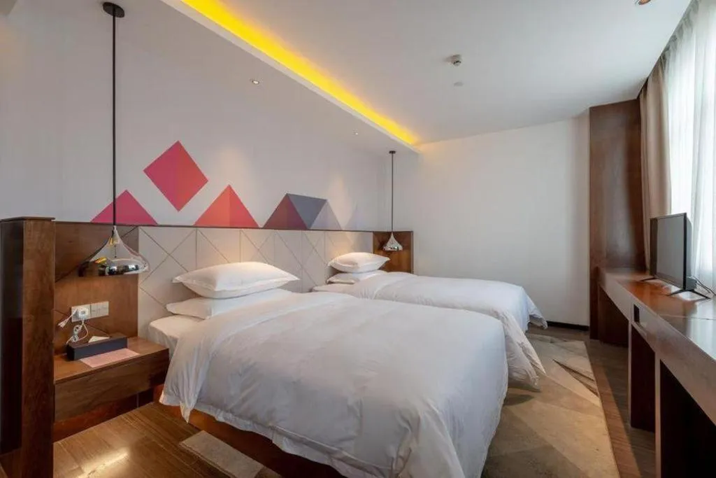 Bed in Borrman Hotel Zhongxiang Railway Station Mochou Village