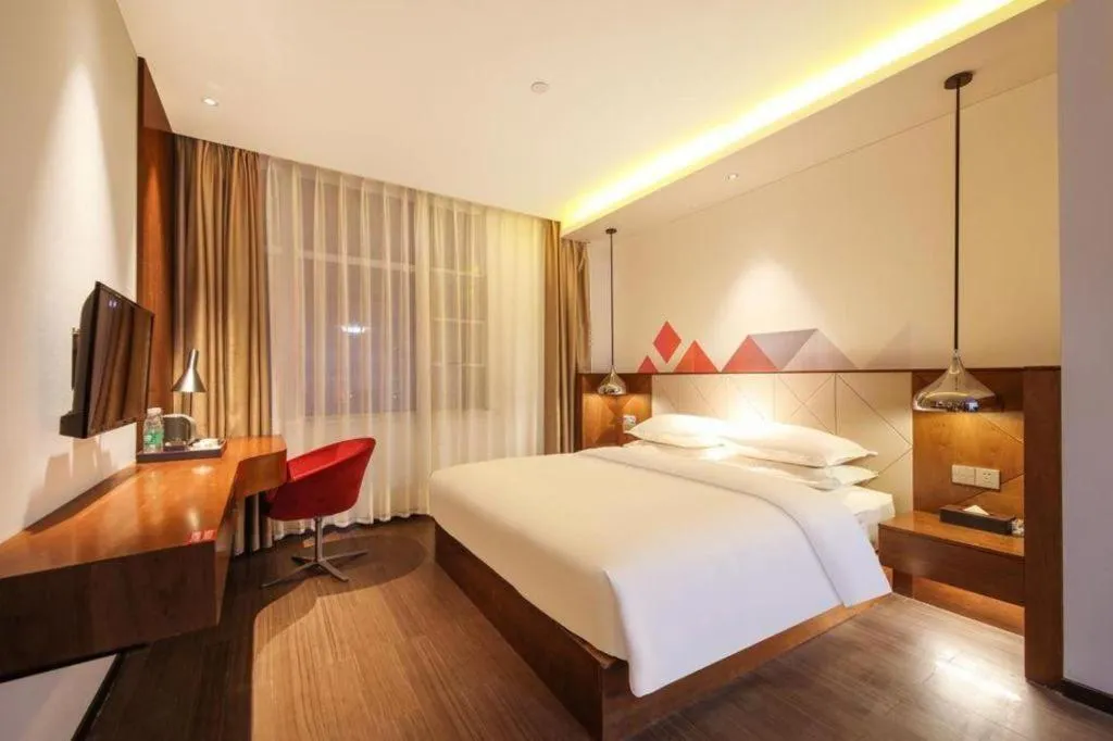 Bed in Borrman Hotel Zhongxiang Railway Station Mochou Village