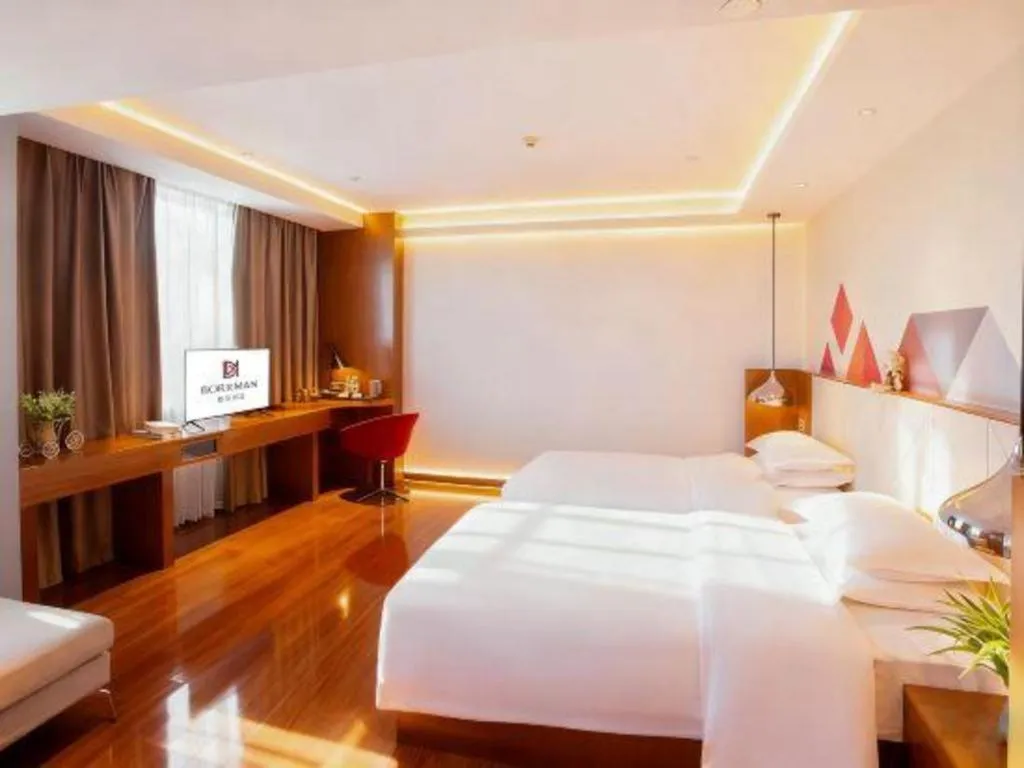 Bed in Borrman Hotel Zhongxiang Railway Station Mochou Village