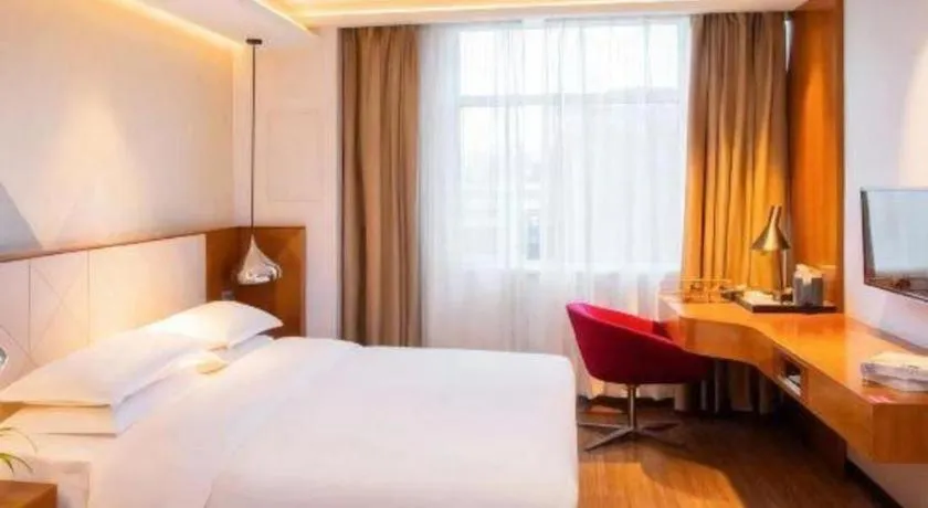 Bed in Borrman Hotel Zhongxiang Railway Station Mochou Village