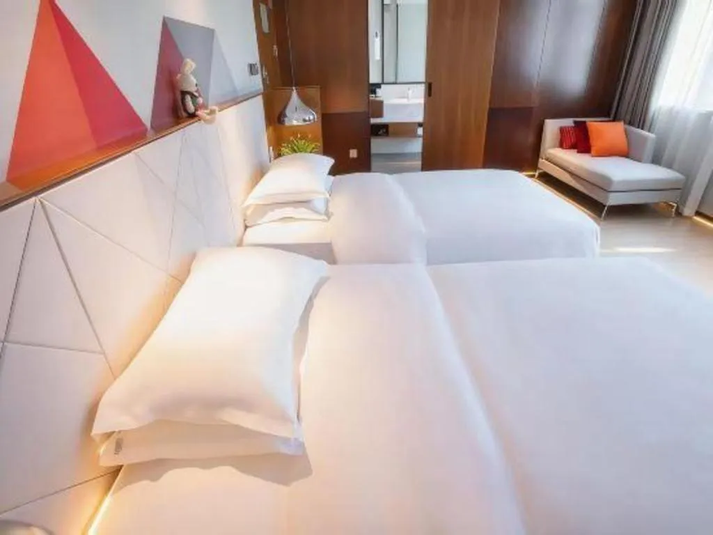 Bed in Borrman Hotel Zhongxiang Railway Station Mochou Village