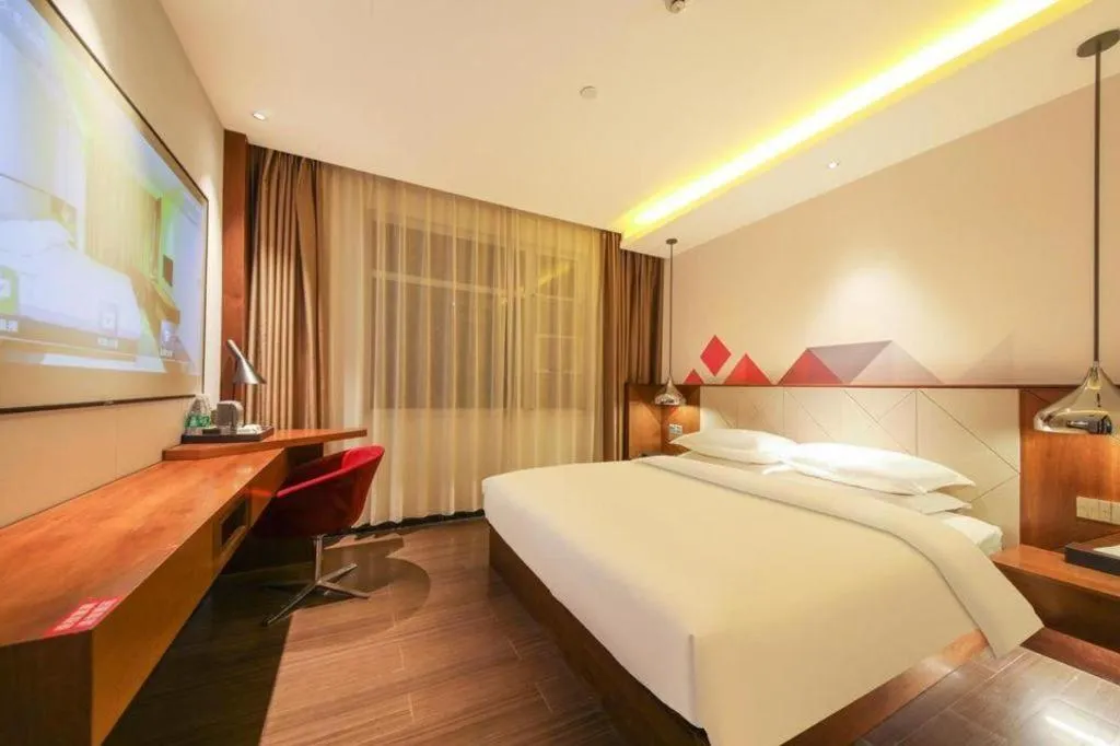 Bed in Borrman Hotel Zhongxiang Railway Station Mochou Village