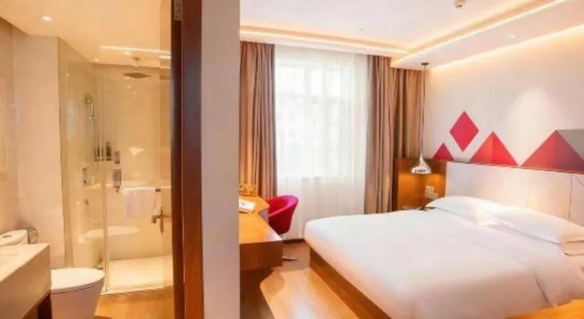 Bed in Borrman Hotel Zhongxiang Railway Station Mochou Village