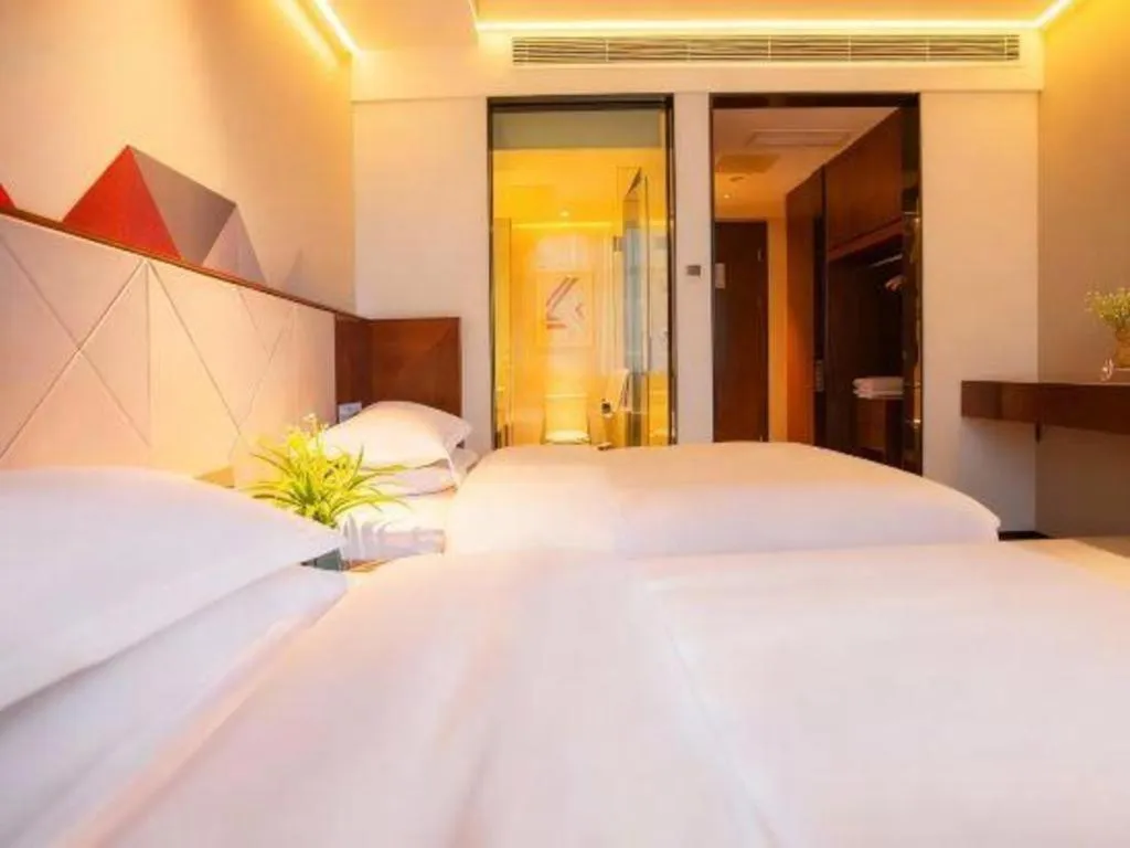 Bed in Borrman Hotel Zhongxiang Railway Station Mochou Village