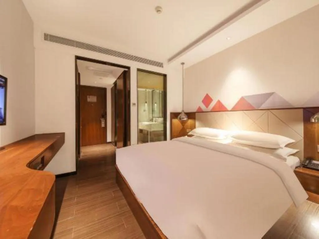 Bed in Borrman Hotel Zhongxiang Railway Station Mochou Village