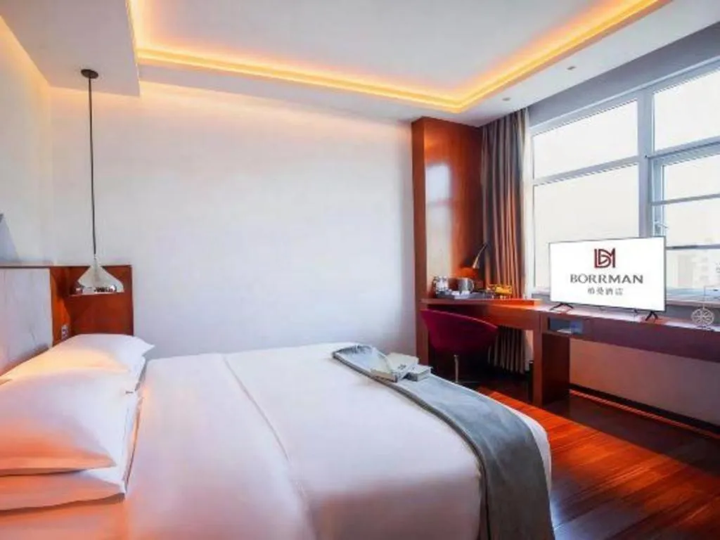 Bed in Borrman Hotel Zhongxiang Railway Station Mochou Village