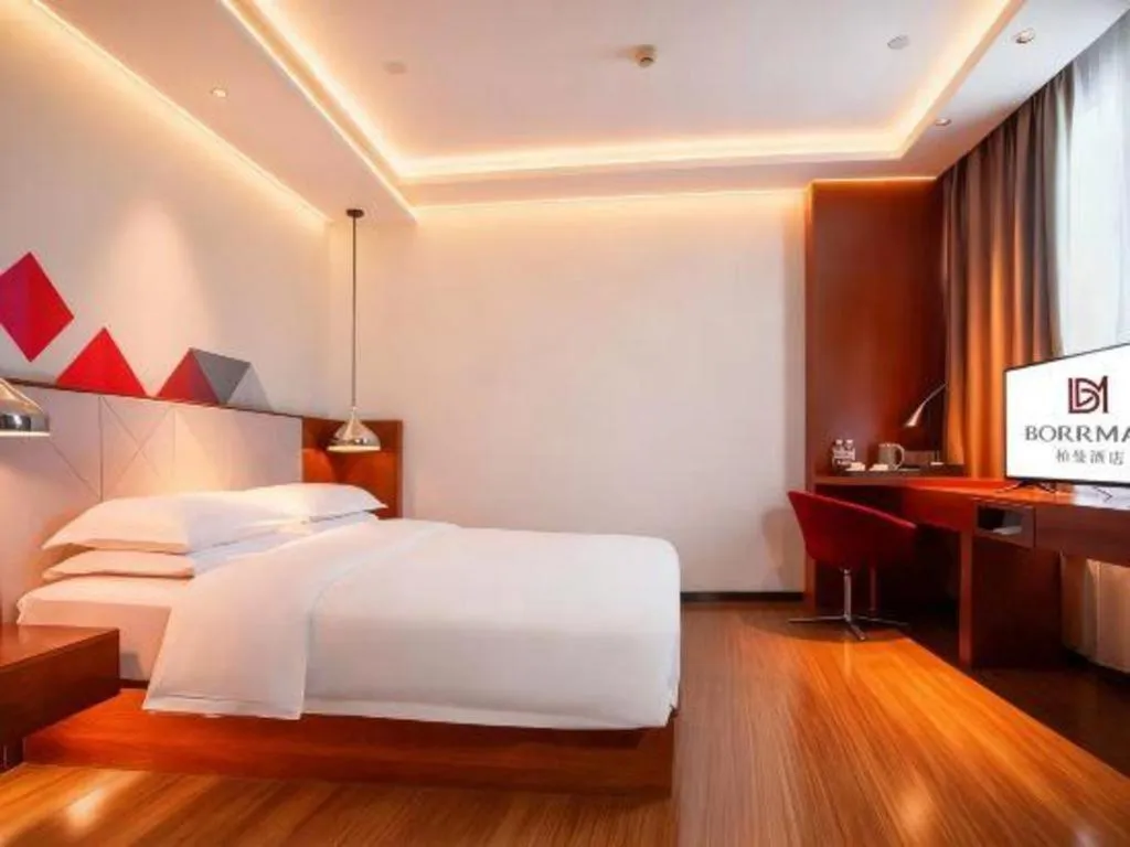 Bed in Borrman Hotel Zhongxiang Railway Station Mochou Village