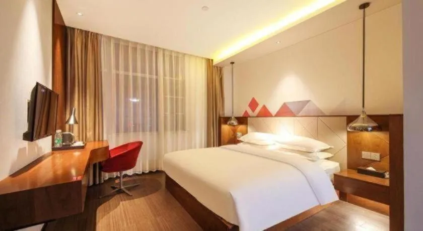 Bed in Borrman Hotel Zhongxiang Railway Station Mochou Village