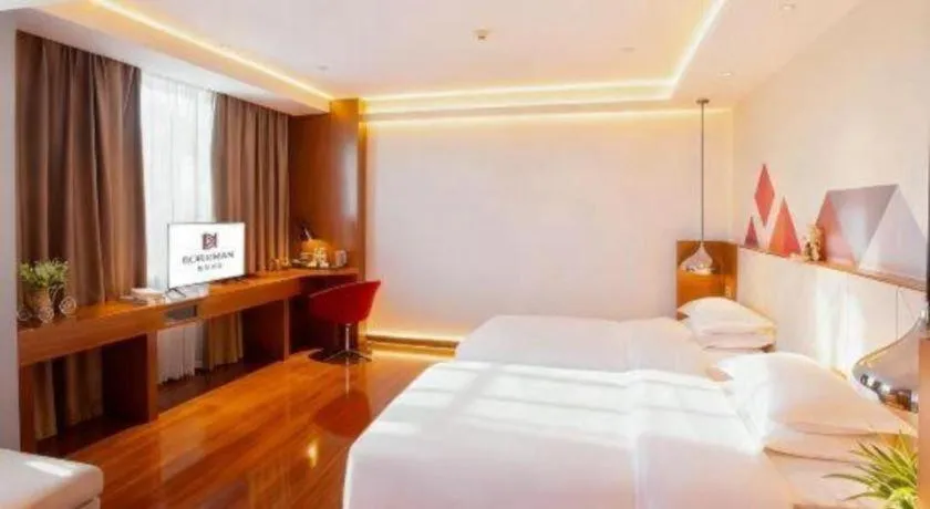 Bed in Borrman Hotel Zhongxiang Railway Station Mochou Village