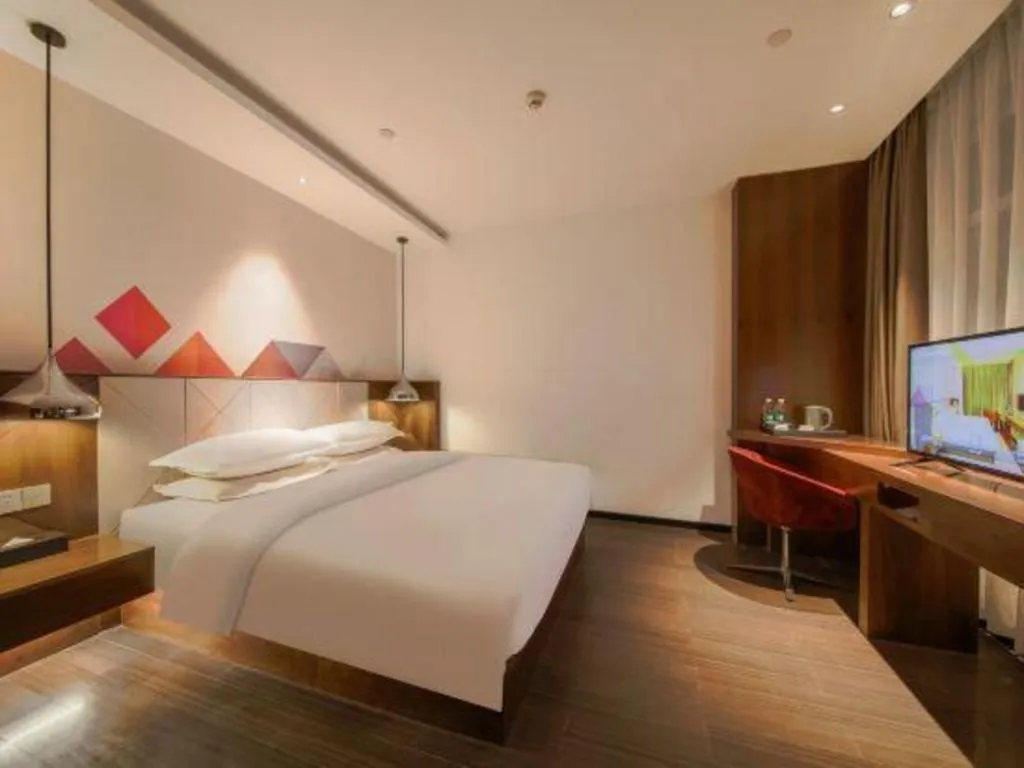 Bed in Borrman Hotel Zhongxiang Railway Station Mochou Village