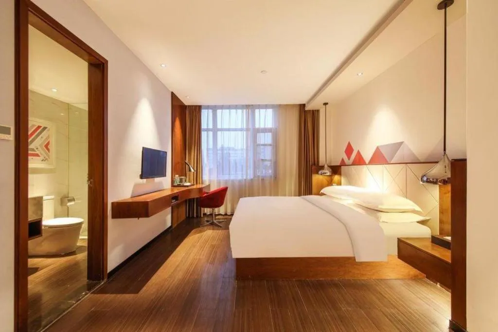 Bed in Borrman Hotel Zhongxiang Railway Station Mochou Village