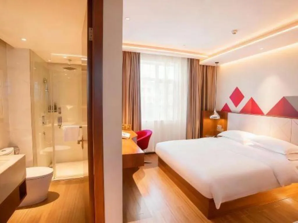 Bed in Borrman Hotel Zhongxiang Railway Station Mochou Village