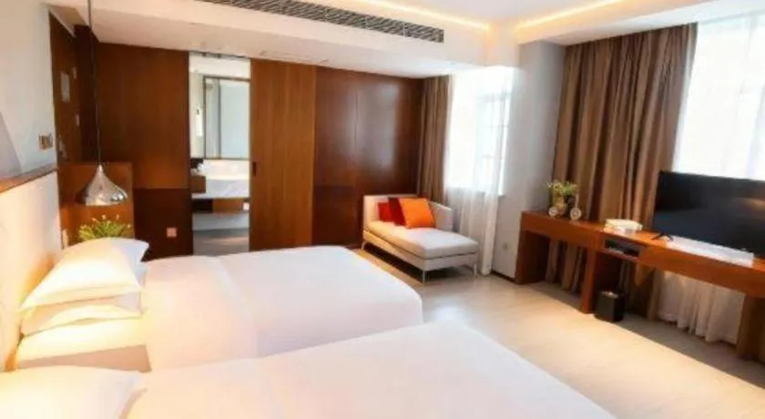 Bed in Borrman Hotel Zhongxiang Railway Station Mochou Village