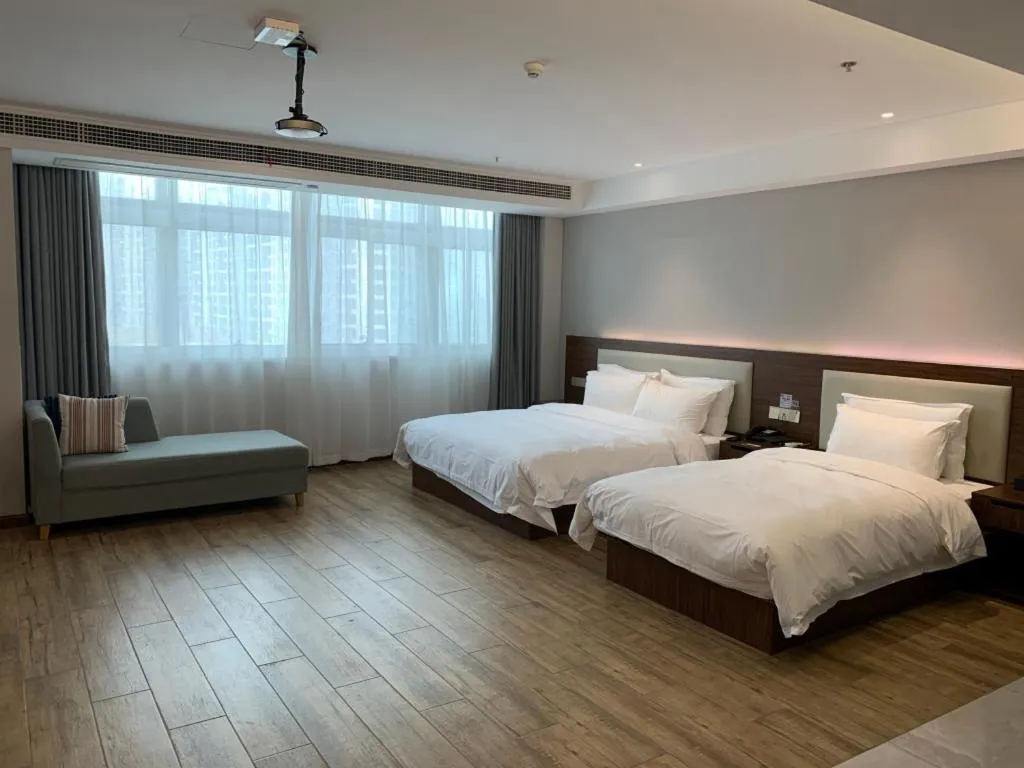 Bed in Borrman Hotel East Huai'an Railway Station Zhou 'Enlai Memorial