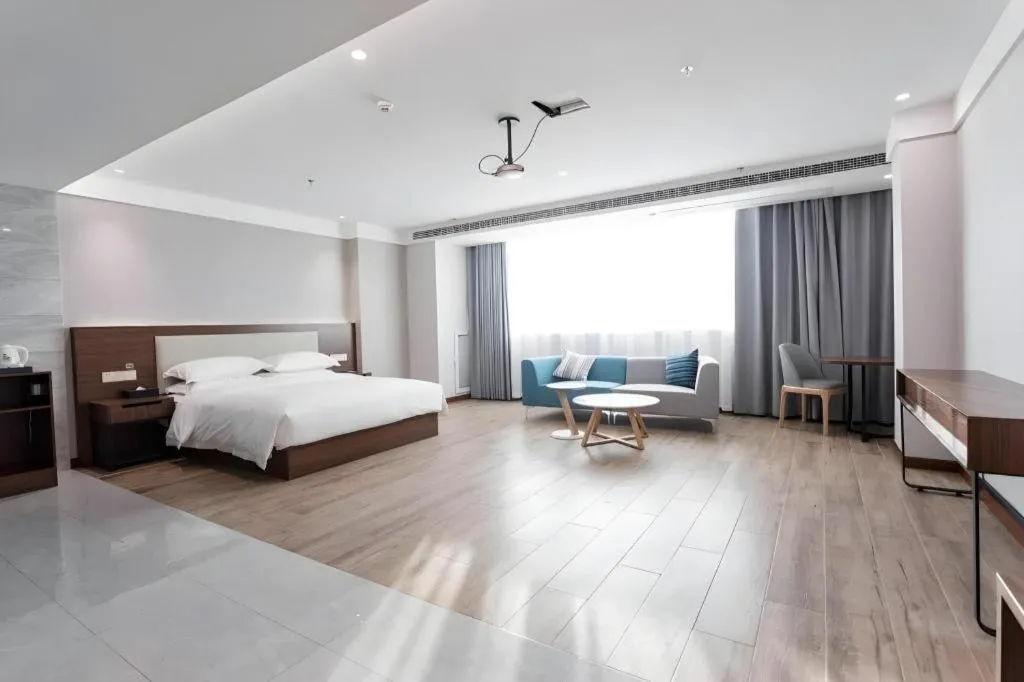 Bed in Borrman Hotel East Huai'an Railway Station Zhou 'Enlai Memorial