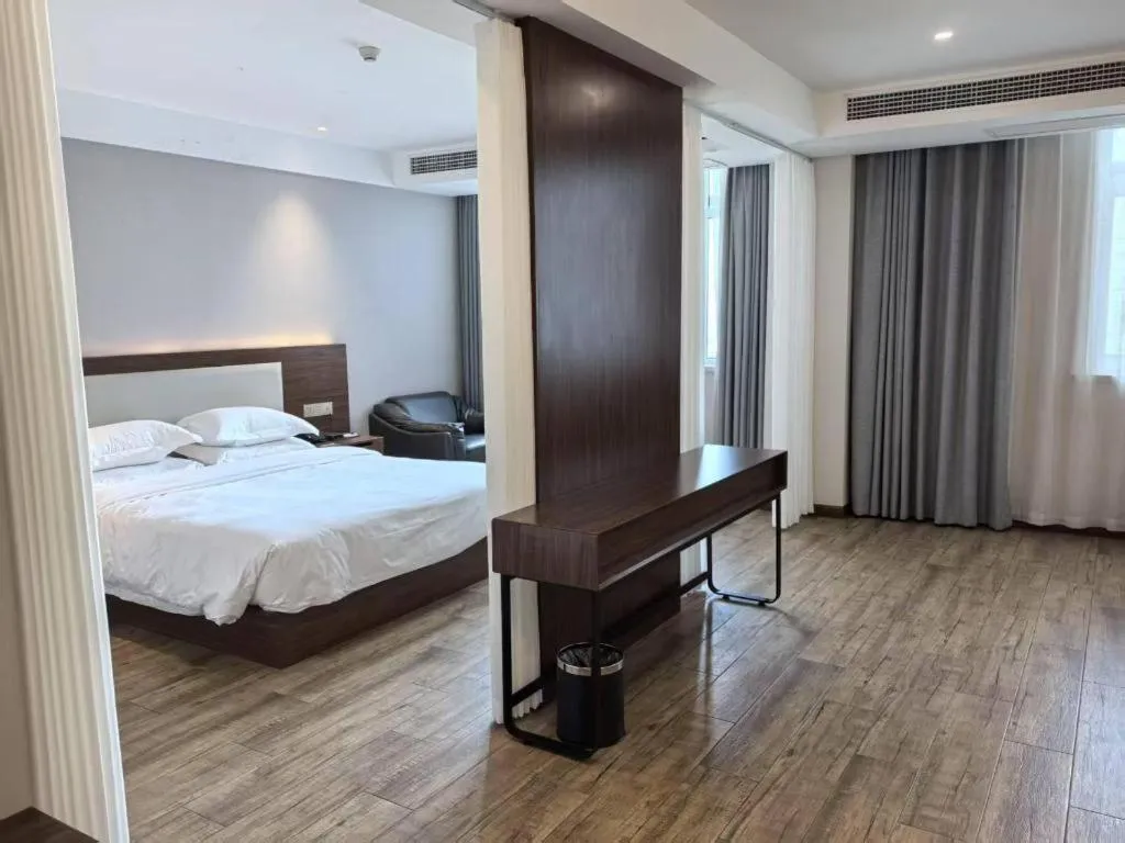 Bed in Borrman Hotel East Huai'an Railway Station Zhou 'Enlai Memorial