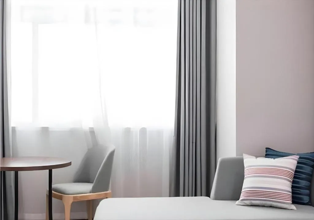 Bed in Borrman Hotel East Huai'an Railway Station Zhou 'Enlai Memorial