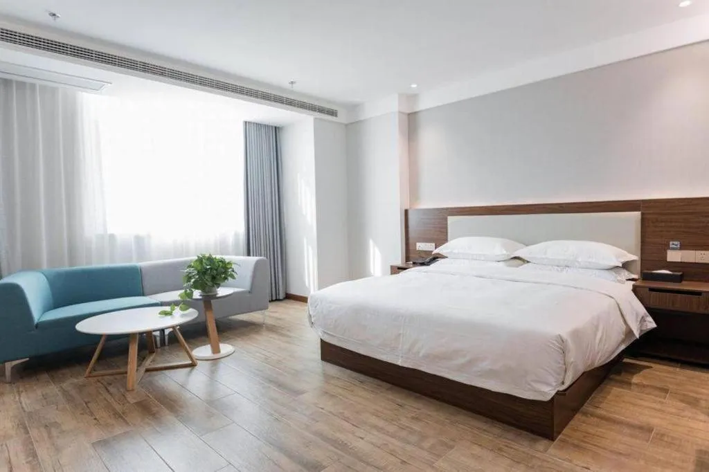 Bed in Borrman Hotel East Huai'an Railway Station Zhou 'Enlai Memorial