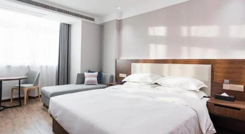 Bed in Borrman Hotel East Huai'an Railway Station Zhou 'Enlai Memorial