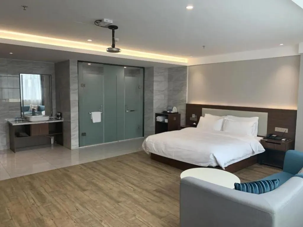 Bed in Borrman Hotel East Huai'an Railway Station Zhou 'Enlai Memorial